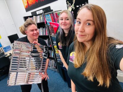 Staff hand out free radiator panels at a drop-in session.