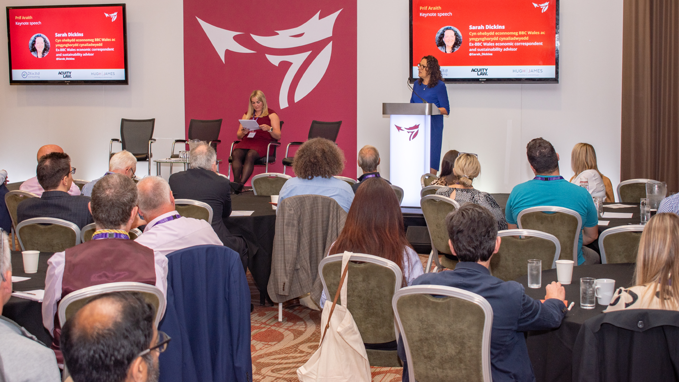 A woman speaking at the One Big conference.