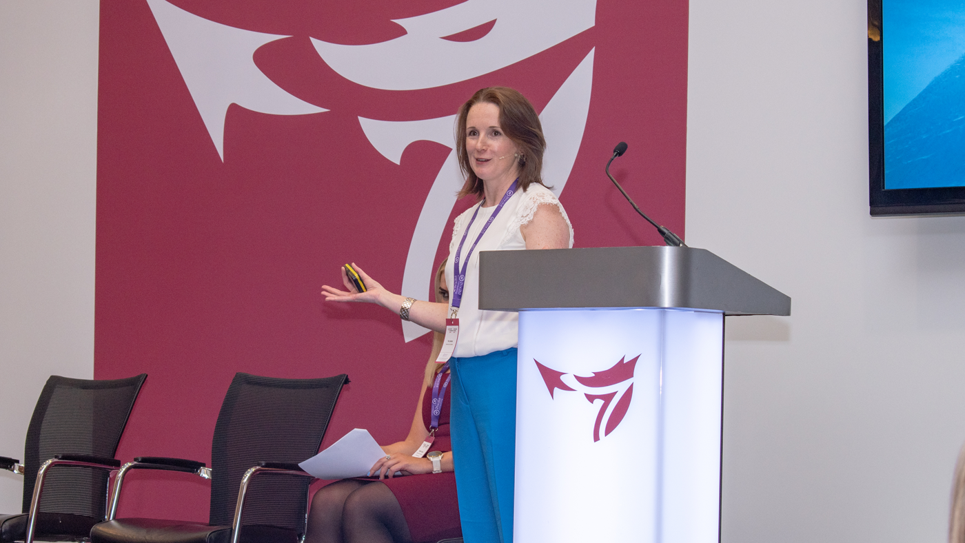 Keynote speaker Tori James on stage speaking at the One Big conference.