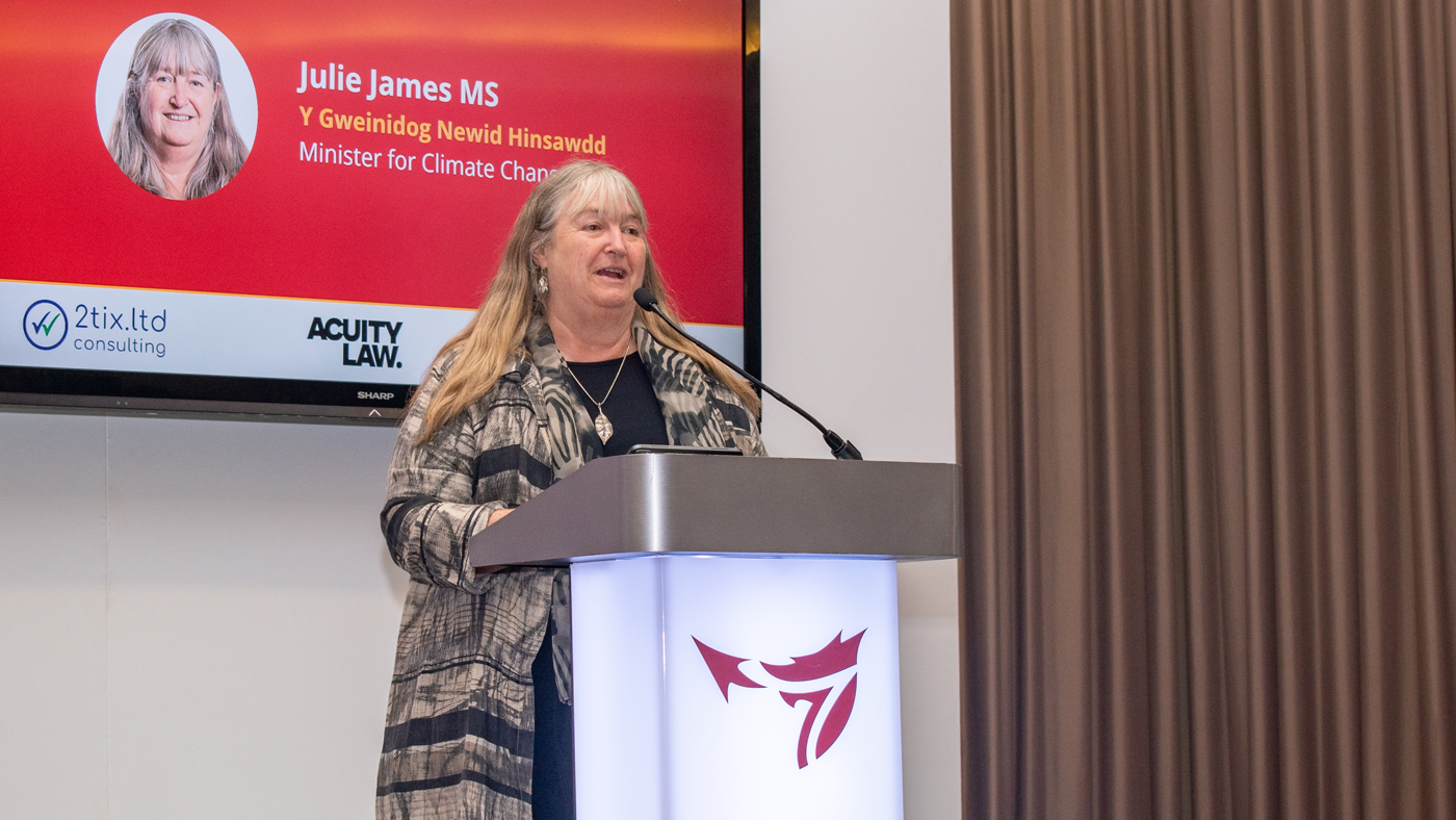 Julie James MS, Minister for Climate Change on stage speaking during the One Big conference.