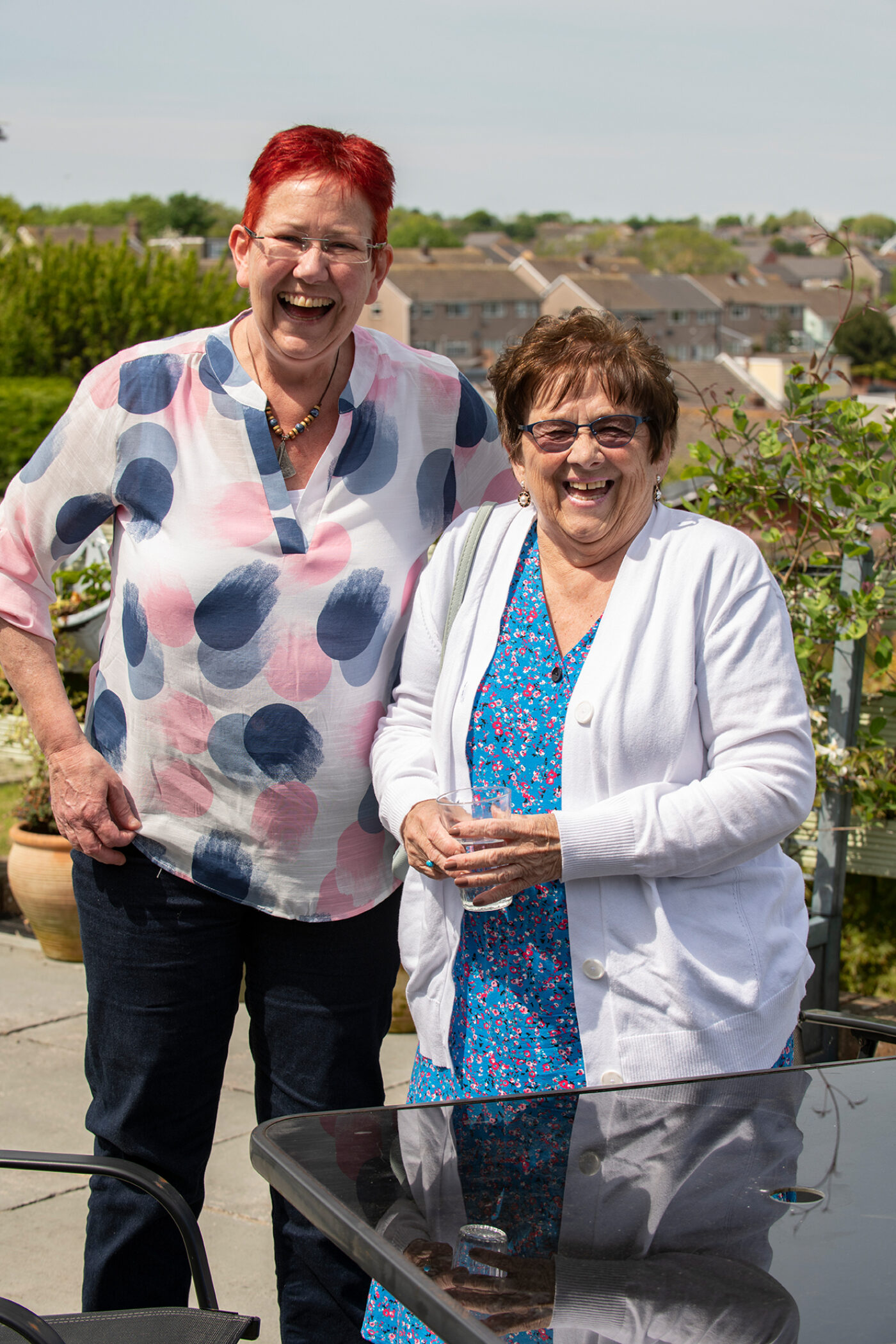 Two women standing together after receiving an award.