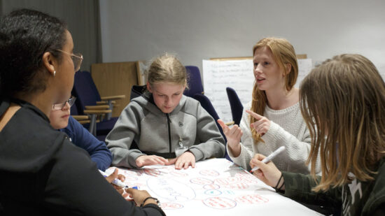 A group of people work on a project together